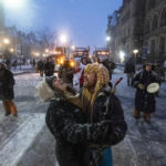 AP PHOTOS: Huddling around fires, dancing at Ottawa protest