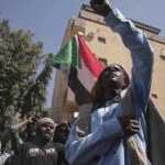 Ex-Sudan official detained as 2 killed in anti-coup protests