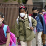 Governors in 4 states plan for end to school mask mandates