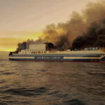 Greek rescuers search burning ferry for 12 missing people