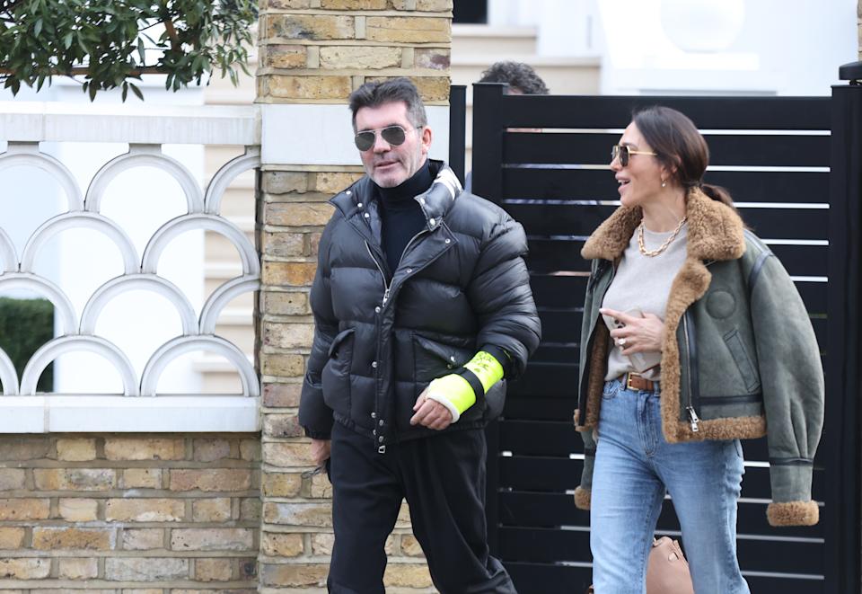 Simon Cowell pictured with broken arm following bike accident