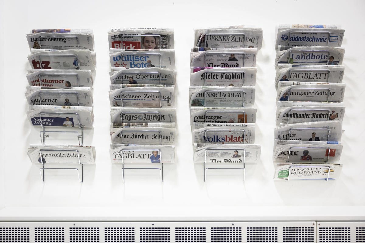 Swiss voters consider public aid plan for newspapers, media