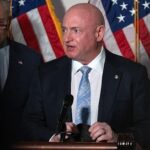 Mark Kelly says White House should characterize Putin as a war criminal