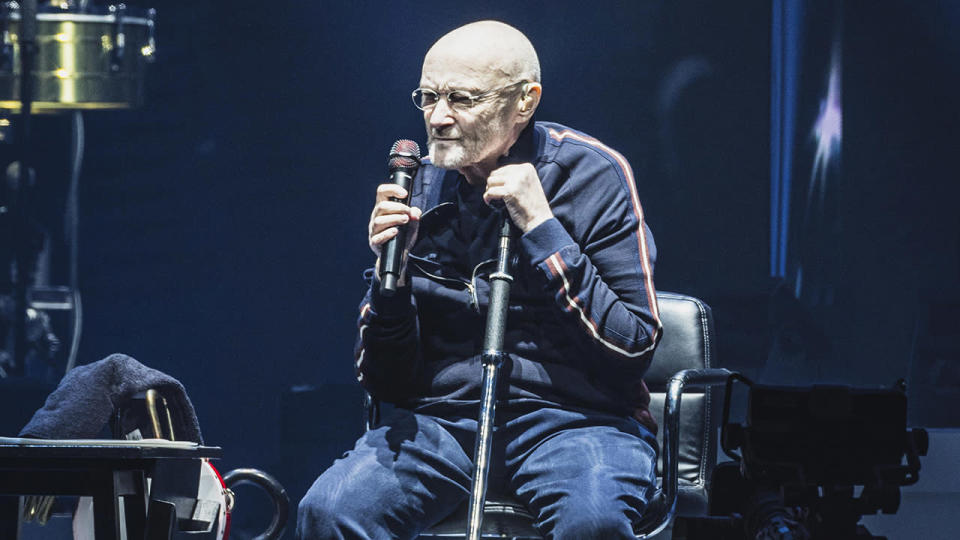 Phil Collins remains seated during Berlin concert months after revealing he can no longer play the drums