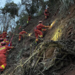 Search at China crash site suspended amid rain