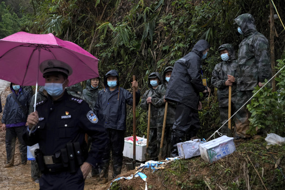 Searchers find wing, engine parts from China Eastern crash