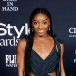 Simone Biles shows off her Burberry and bright green swimsuits on vacation with new fiancé