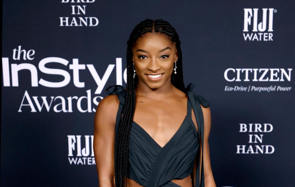 Simone Biles shows off her Burberry and bright green swimsuits on vacation with new fiancé