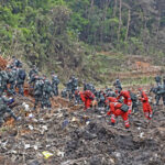 Terrain, rain hampering search at site of China plane crash