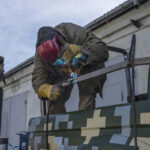 Ukrainian welders turn donated vehicles into army transport