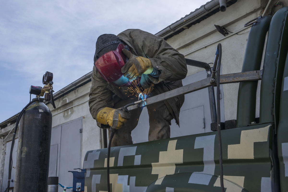 Ukrainian welders turn donated vehicles into army transport