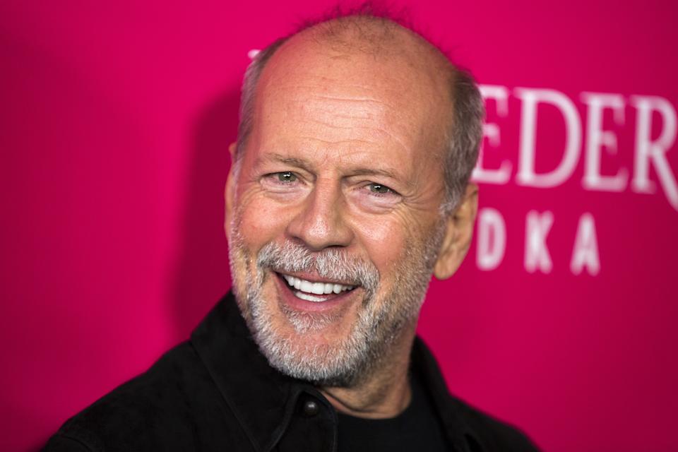 Bruce Willis goes biking with daughters after aphasia announcement