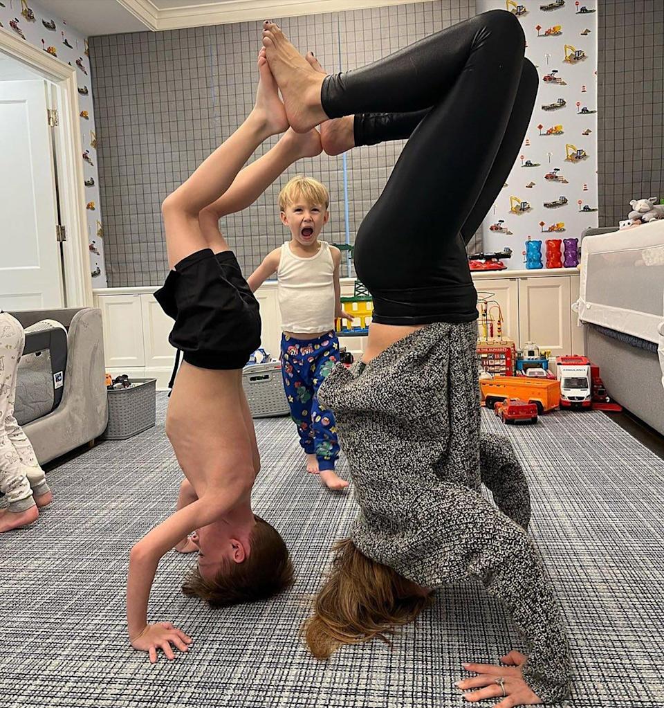 Hilaria Baldwin Poses Upside Down with Sons Rafael and Romeo for Pregnant Yoga: ‘Lucky Mama’