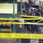 Police hunt gunman who wounded 10 in Brooklyn subway attack