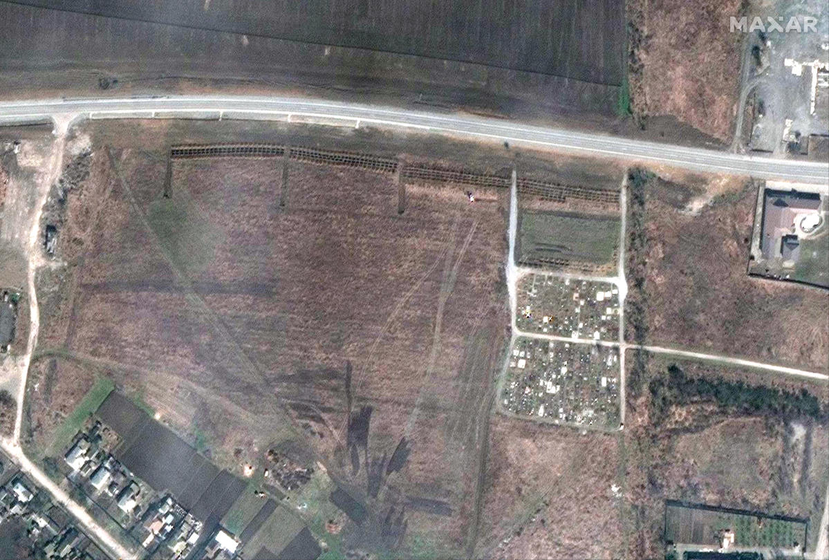 Possible mass graves near Mariupol as Russia attacks in east