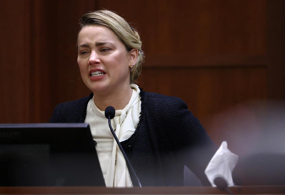 Amber Heard breaks down on the stand, claims Johnny Depp penetrated her with liquor bottle