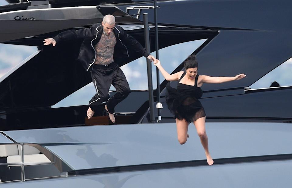 Kourtney Kardashian and Travis Barker Take a Lovers’ Leap from a Superyacht One Day After Their Wedding