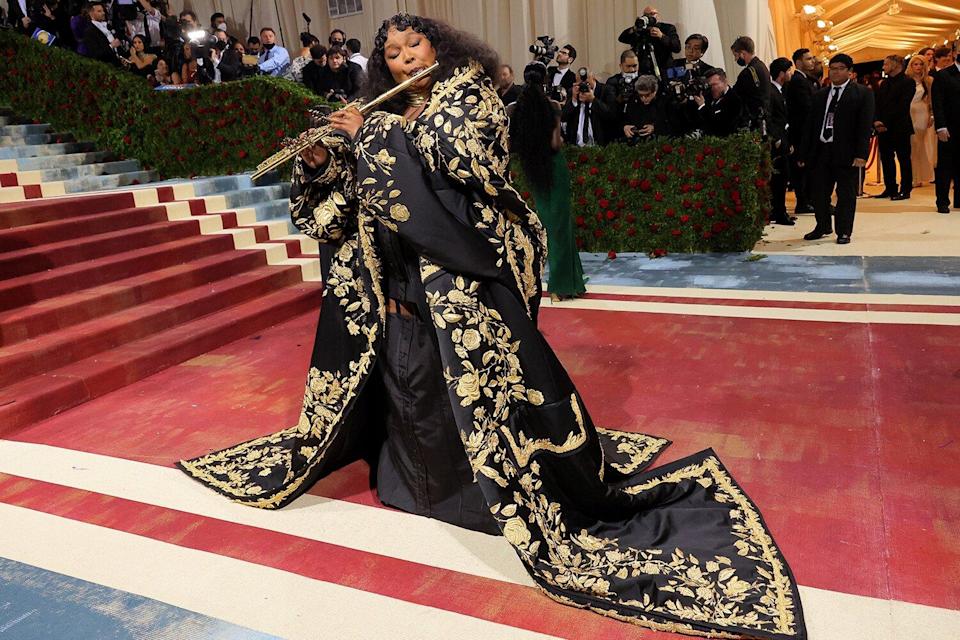 Lizzo Goes for Drama in Embroidered Coat and Brings Special Met Gala Accessory — Her Flute!