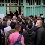 Mired in crises, Lebanese begin voting for new parliament