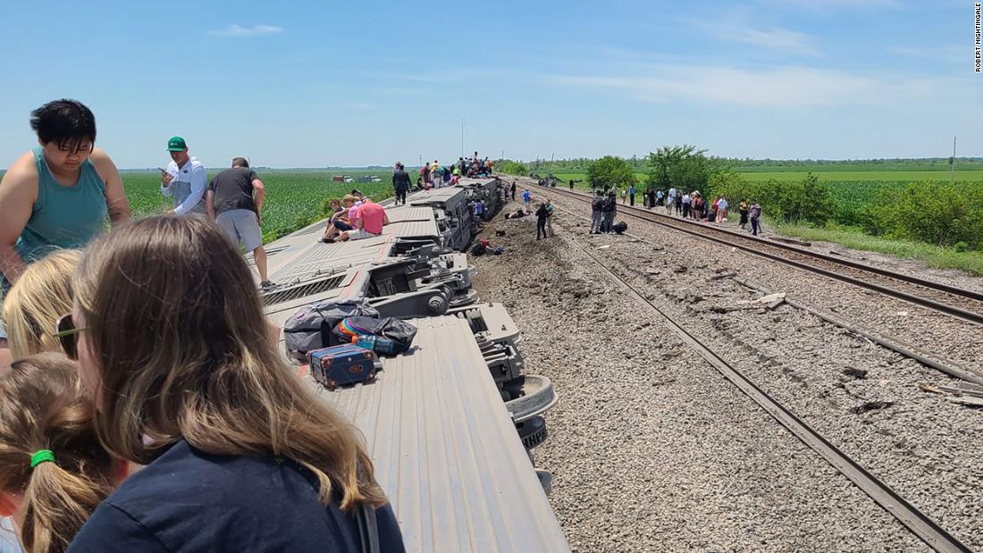 At least three people are dead and dozens injured after a train hit a dump truck and derailed