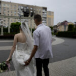 Carpe diem: In Ukraine, war turning love into marriages