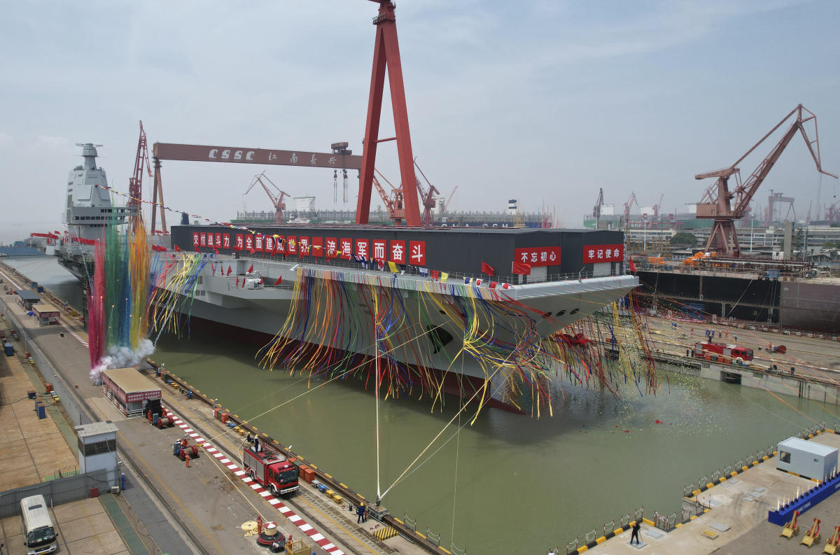 China launches high-tech aircraft carrier in naval milestone