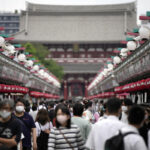 Japan eases foreign tourism ban, allows guided package tours