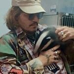 Johnny Depp cuddles badger cub named Freddie Mercury