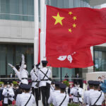 Hong Kong leaders attend flag-raising marking Chinese rule