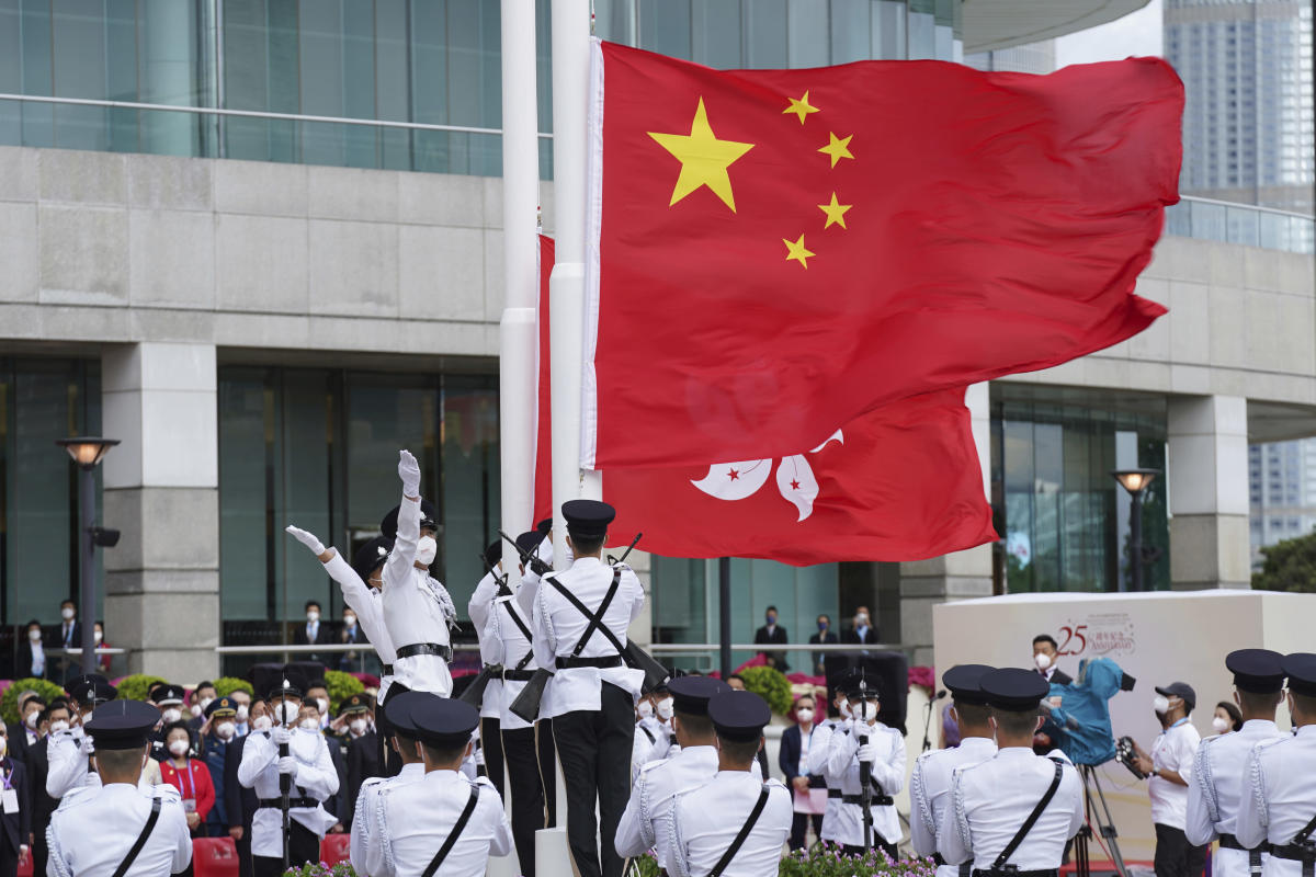 Hong Kong leaders attend flag-raising marking Chinese rule