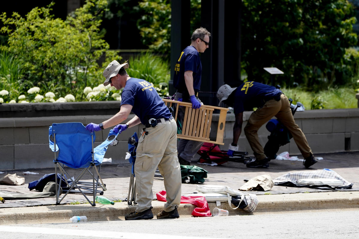 Parade shooting suspect bought 5 weapons despite threats