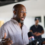 Senator Raphael Warnock uses a new ad to pressure Herschel Walker to commit to a debate.