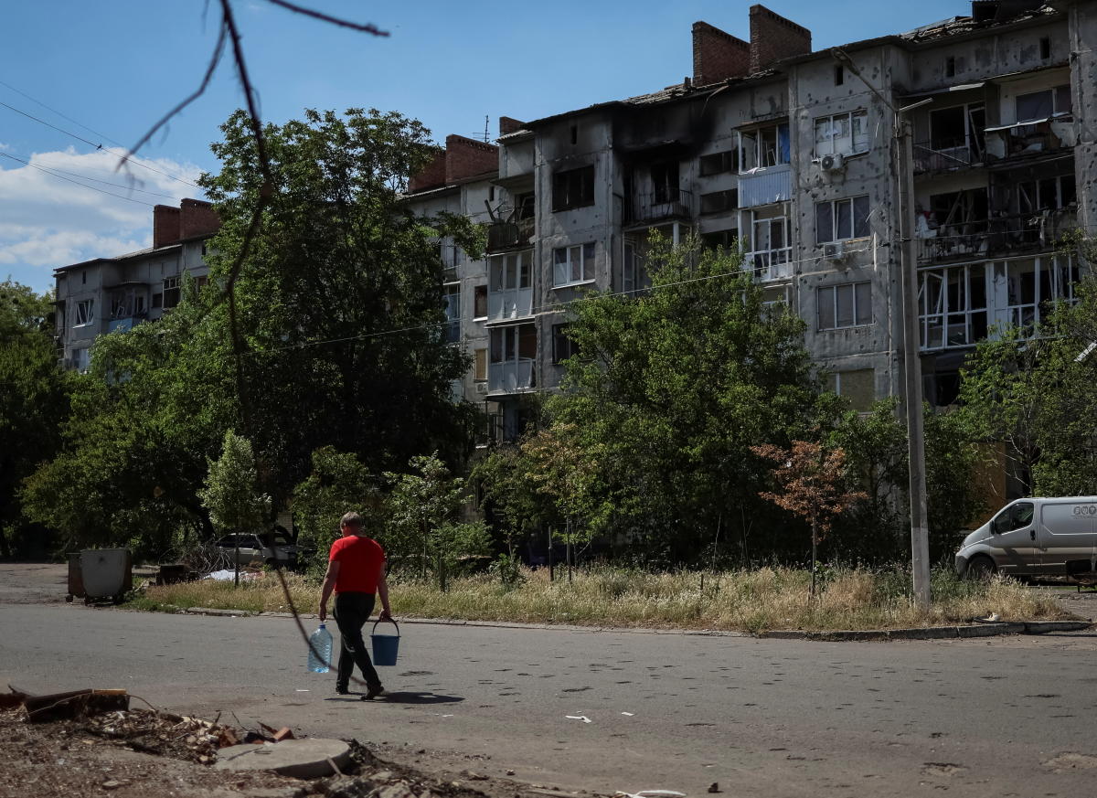 Ukrainian city’s residents urged to evacuate as Russian assault begins