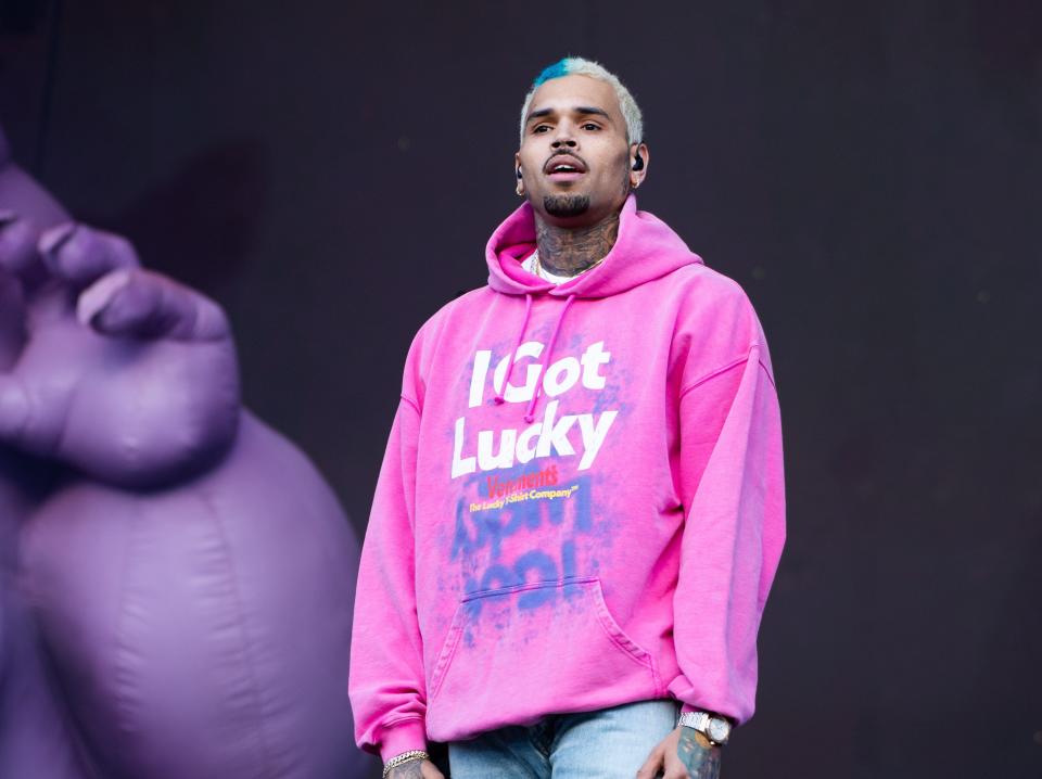 Chris Brown defends taking risqué photos with female fans at meet-and-greets and says he’s not like other ‘lame’ artists ‘that won’t make eye contact’ with fans