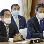 Japan PM names new Cabinet, shifting some over church ties