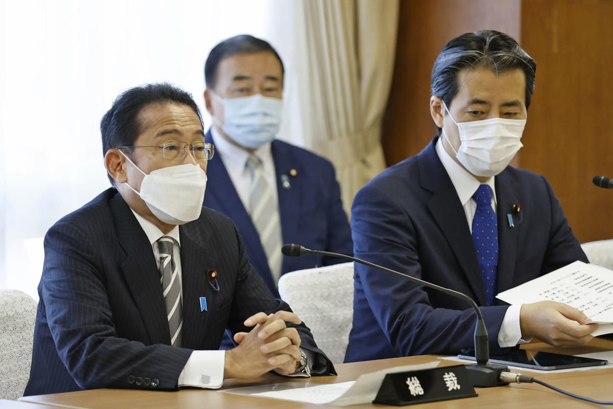 Japan PM names new Cabinet, shifting some over church ties