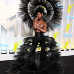 Lil Nas X Wears Extravagant Headpiece And Skirt Outfit To 2022 VMAs