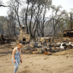 Wind-whipped fire leaves Northern California hamlet in ashes