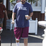 Adam Sandler uses cane as he recovers from hip surgery