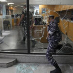 Armed woman breaks into Beirut bank, takes trapped savings