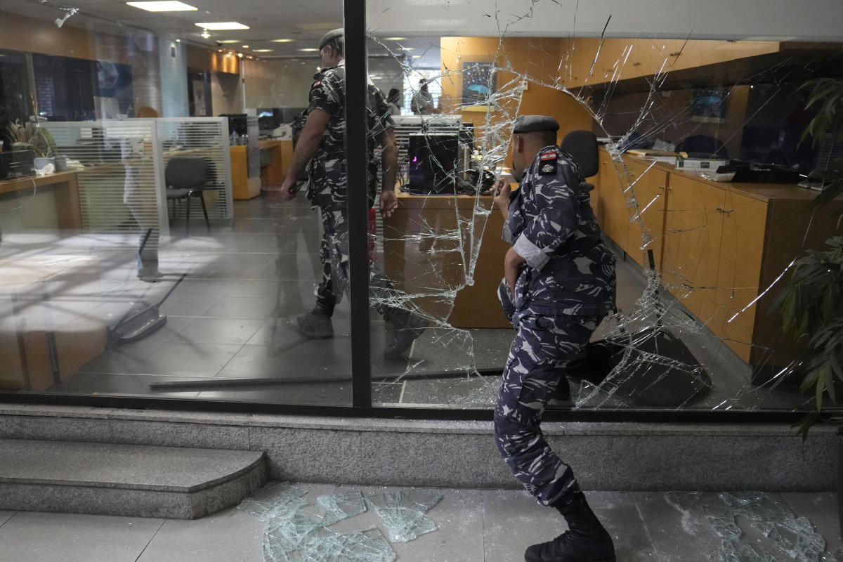 Armed woman breaks into Beirut bank, takes trapped savings