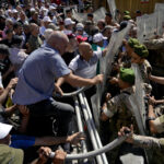 Lebanon retirees scuffle with police; banks partially reopen