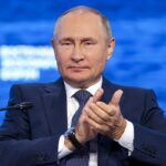 Putin mocks West, says Russia will press on in Ukraine