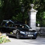 Queen Elizabeth’s Coffin Seen for First Time as It Travels from Balmoral Castle to Edinburgh