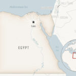 Vessel runs aground, briefly blocking Suez Canal