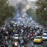 Violent unrest continues in Iran, state TV suggests 26 dead