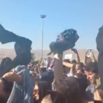 Women in Iran defy the Islamic regime by removing their headscarves and waving them in the air in protests over police custody death, video shows