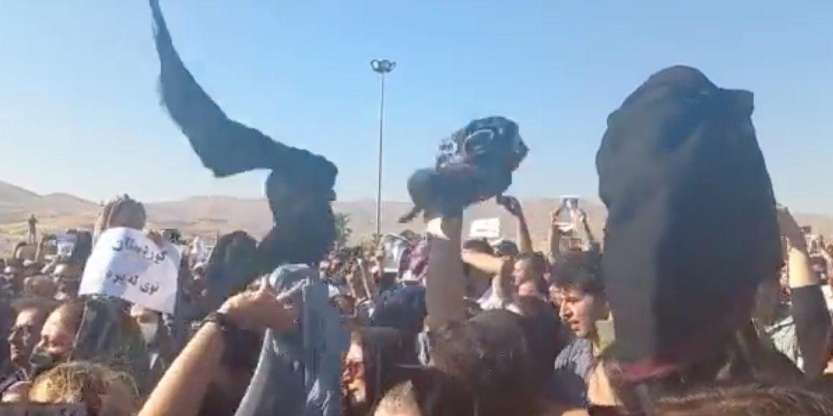 Women in Iran defy the Islamic regime by removing their headscarves and waving them in the air in protests over police custody death, video shows