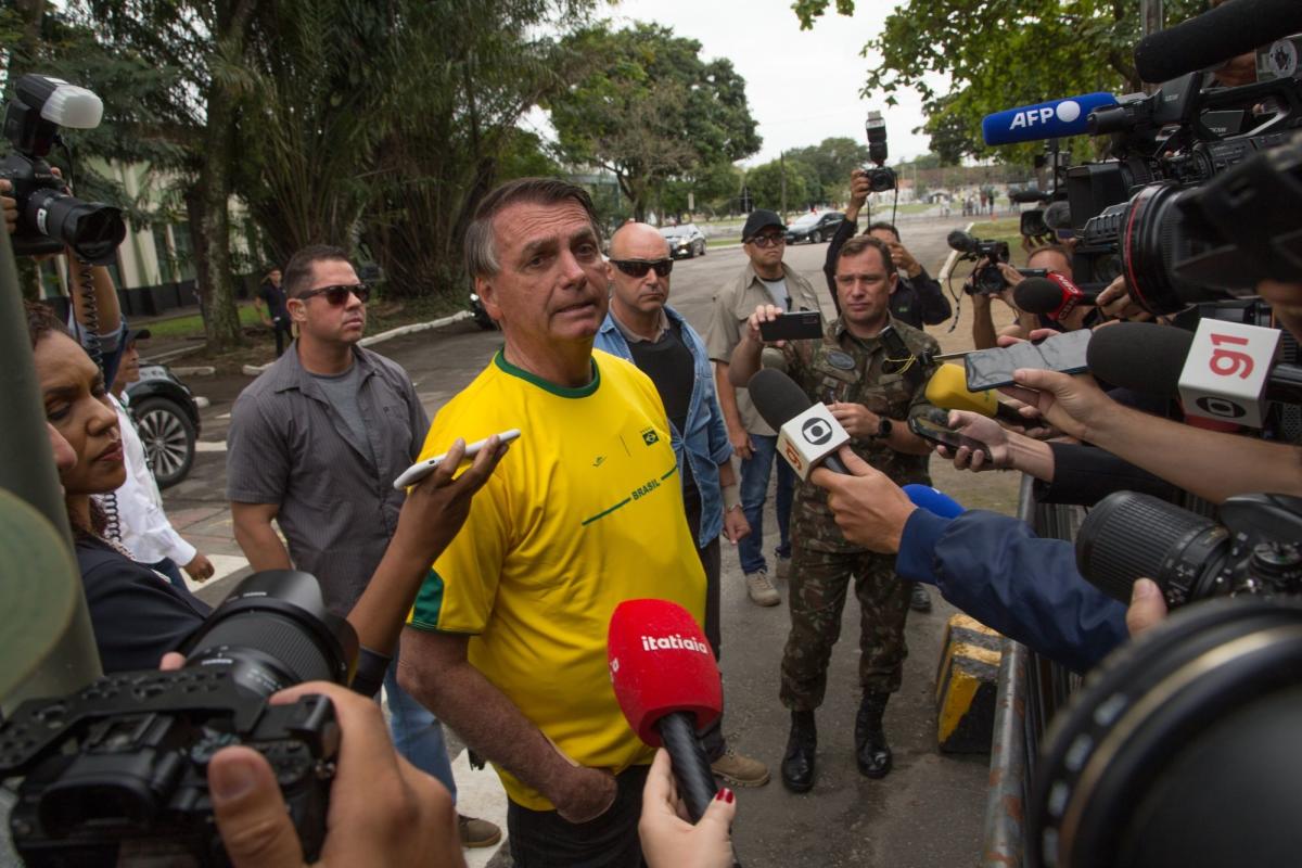 Bolsonaro Biting His Tongue to Seek Advantage in Brazil’s Runoff