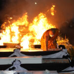 Families bid farewell as Thai massacre victims are cremated